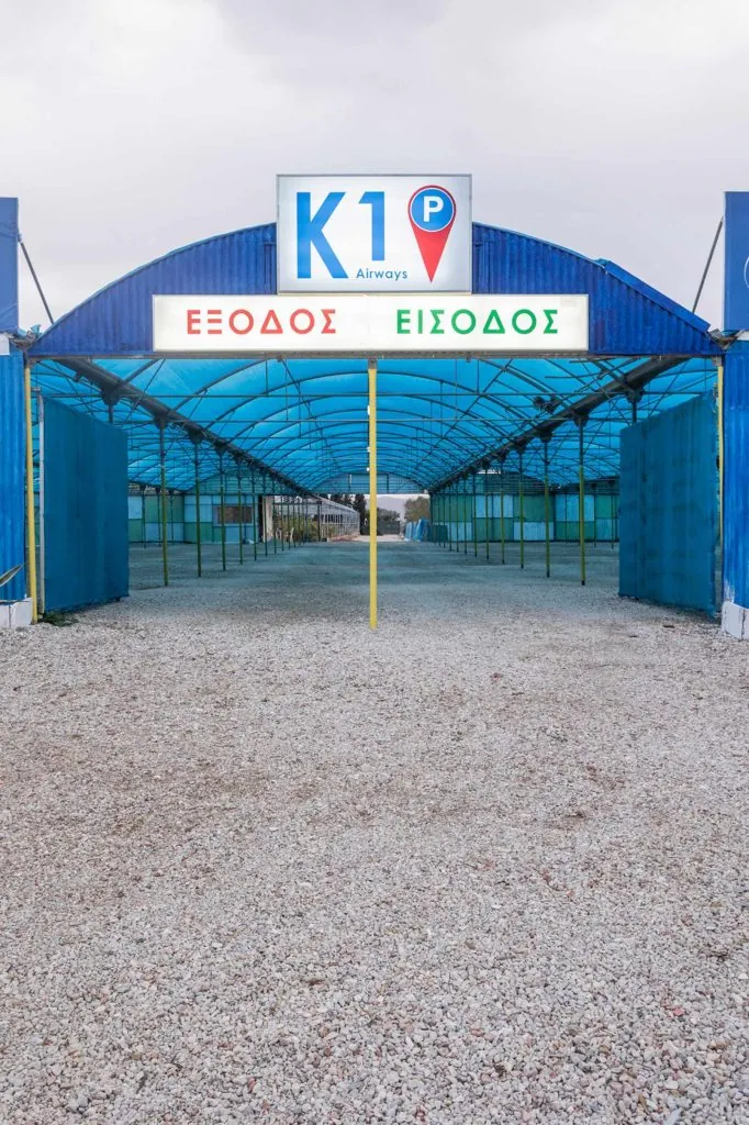 The K1 Parking entrance with the K1 Airways sign and the entry-exit markings